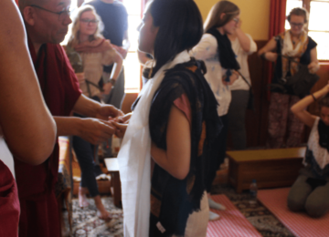 His Excellency Abbot Khen Rinpoche Thupten Tenzin presenting a sacred gift to our Founder, Ishana Malkani
