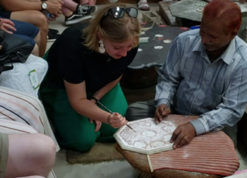Day 9: Marble Showroom Demonstration - Students enjoy a demonstration of how intricate marble artwork, similar to the marble artwork that they saw on the Taj Mahal, is still being made today in Agra.
