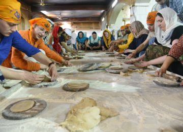 Making Rotis (Indian Bread) at Langar - A Sikh community kitchen at Gurudwara Bangla Sahib, Delhi