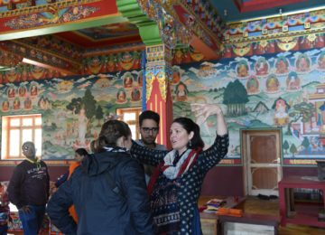 Prof of Religion talking to her students about the origins of Buddhism at Phyang Monastery, Leh, Jammu & Kashmir