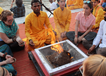 Participating in a 'Yajna', a ritual done in front of a sacred fire, with the chanting of vedic mantras